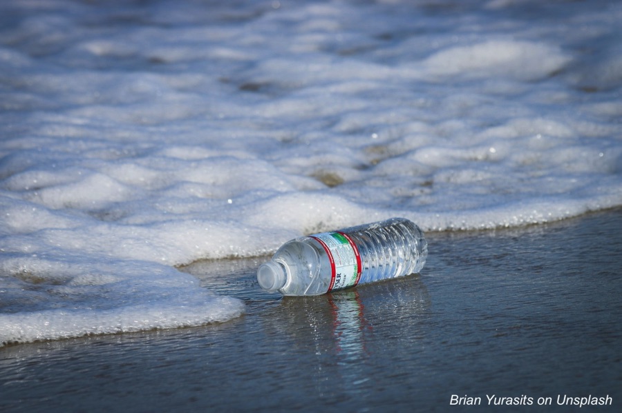 Discarded plastic water bottle on a beach